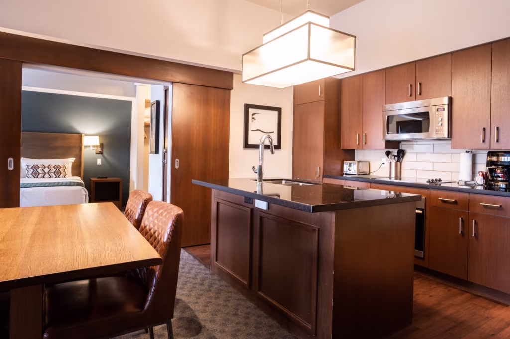 2 Bedroom Suite Kitchen And Living Area Evolution Whistler Hotel