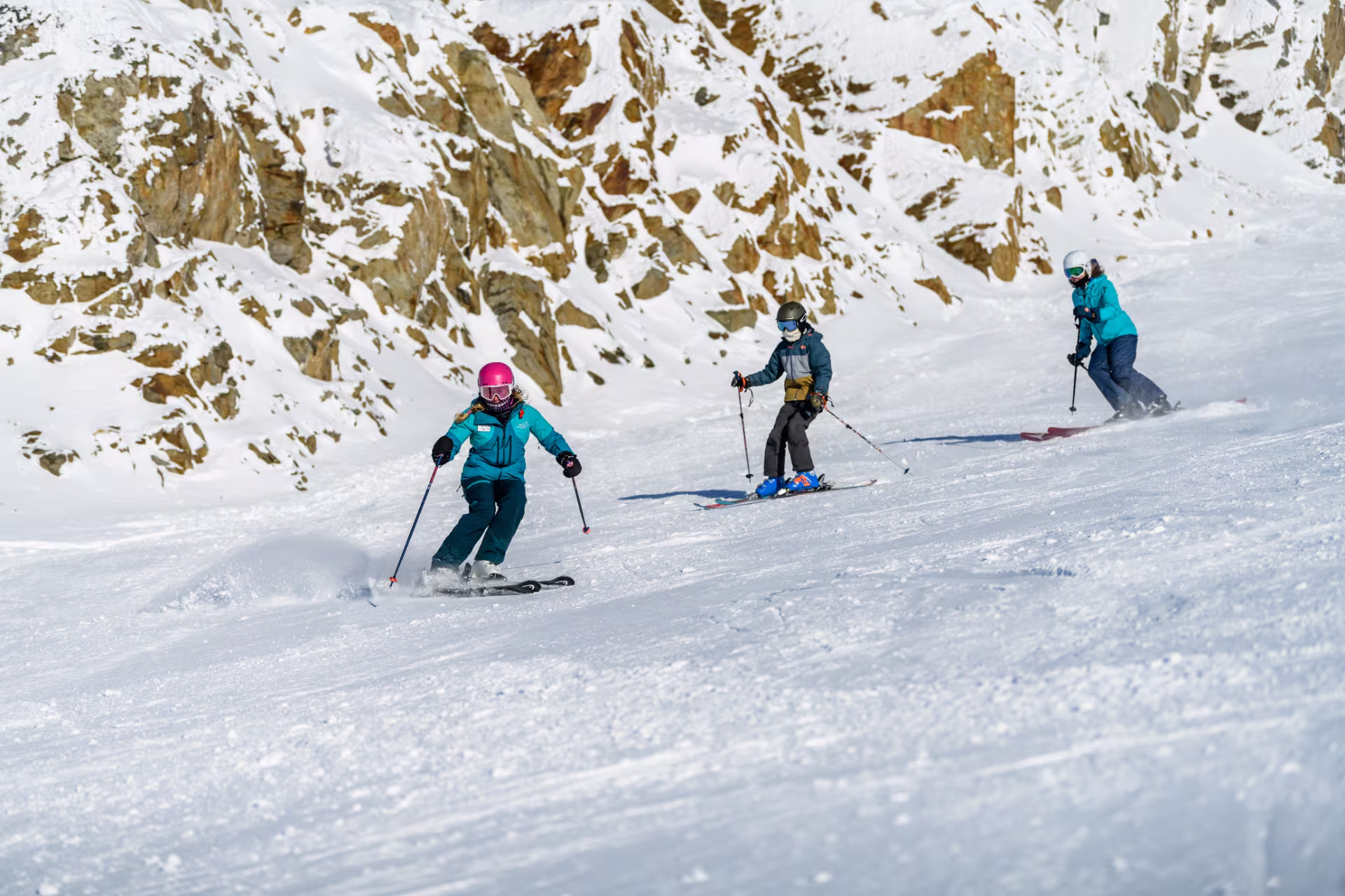 Skiers learning to navigate the snowy mountain terrain of Whistler Blackcomb in Whistler, BC.