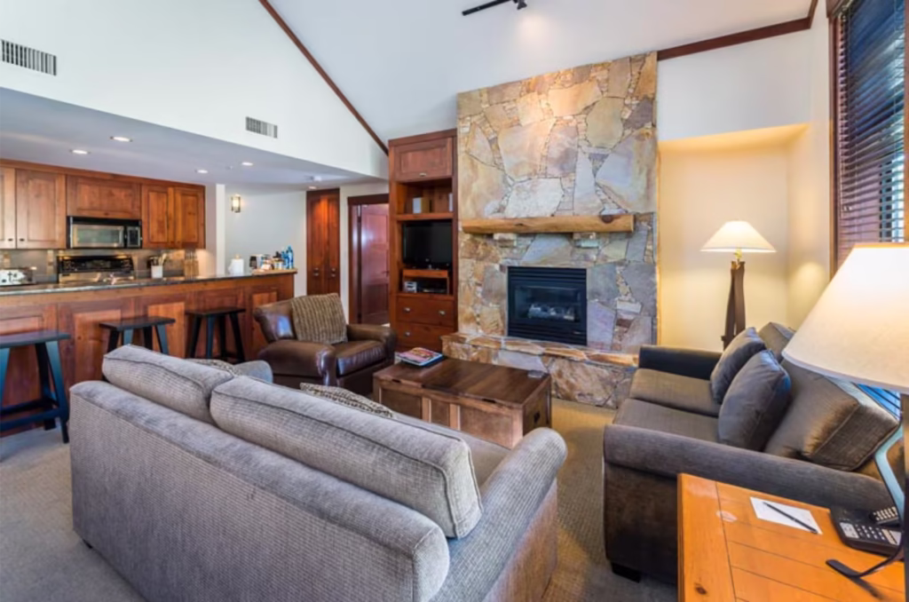 Living Room + Kitchen At First Tracks Lodge Whistler Hotel